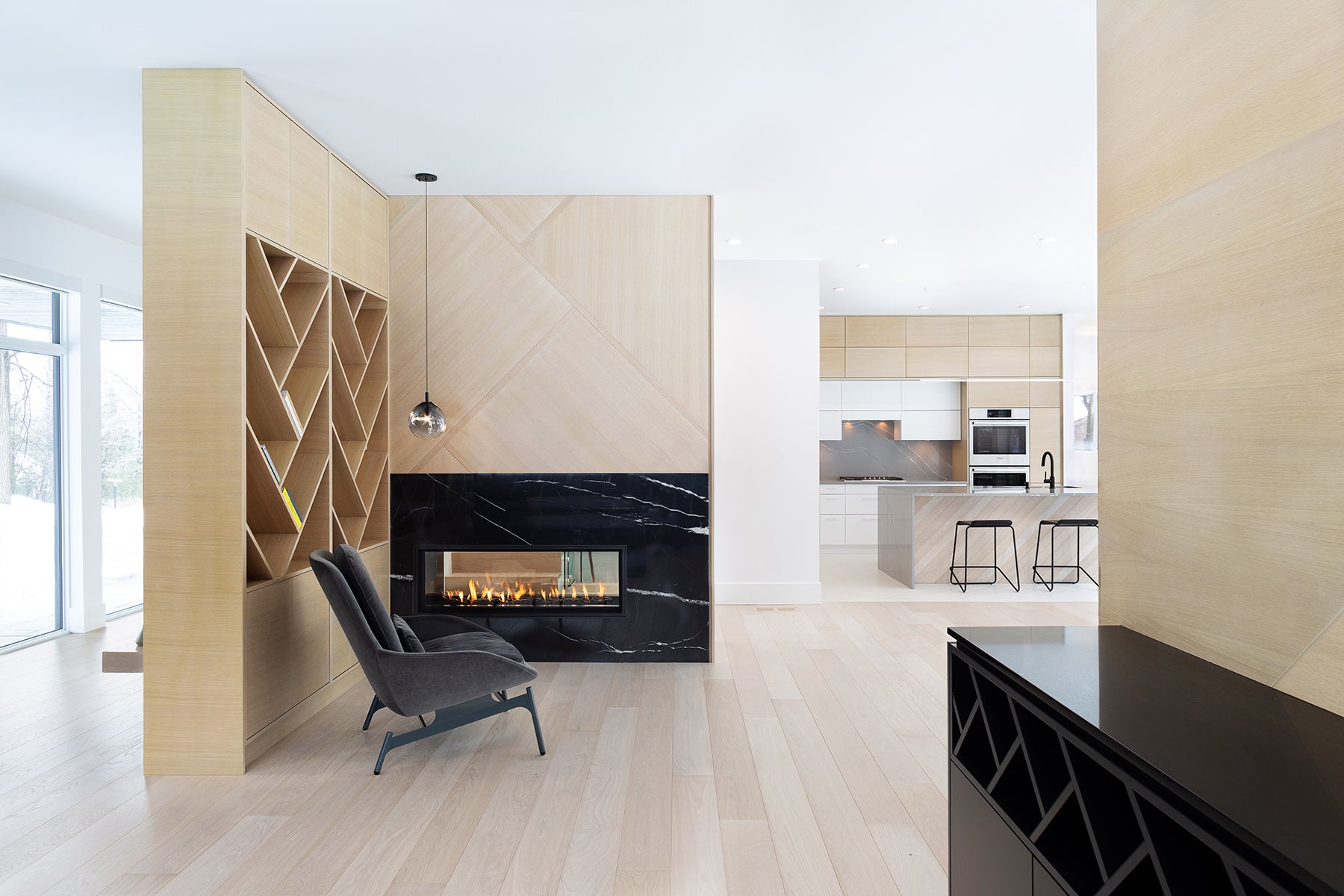 an interior view with midcentury modern furniture and northern wide wood planks on the floor