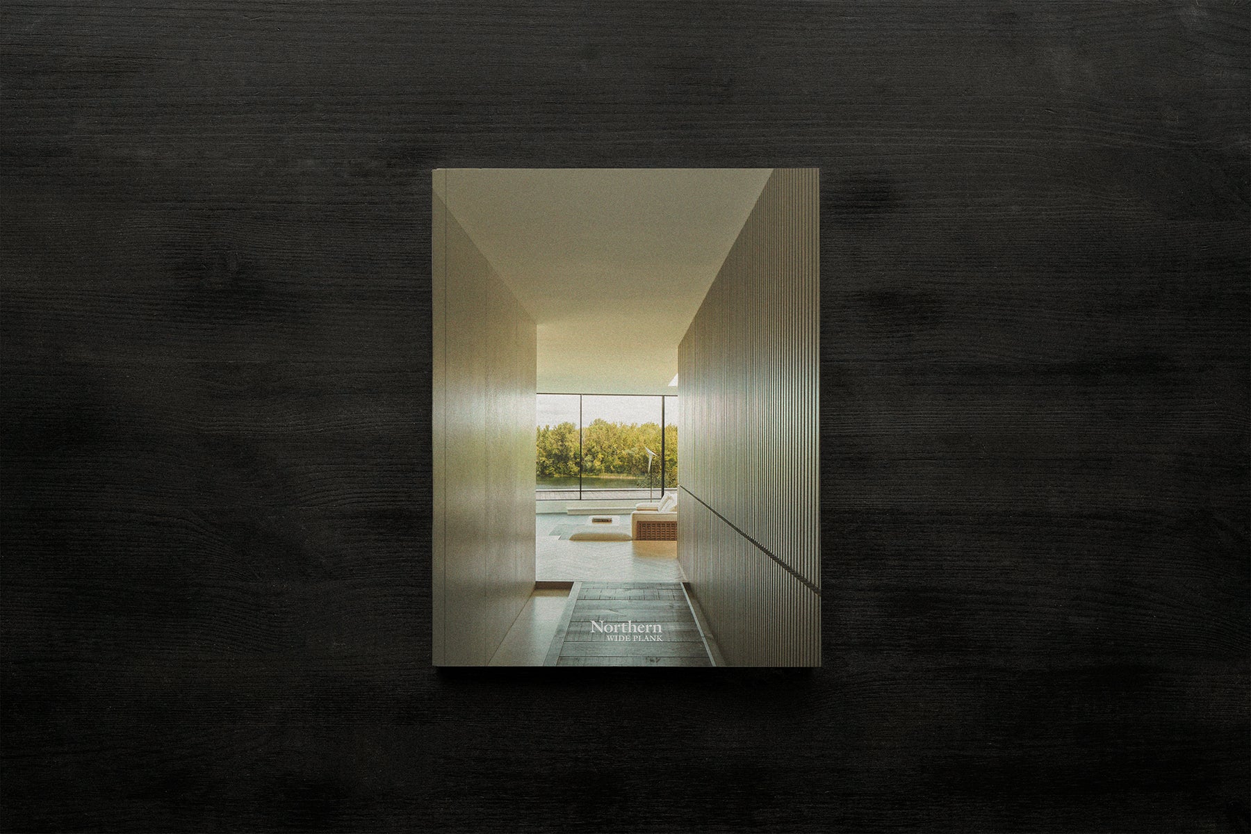 an interior view with midcentury modern furniture and northern wide wood planks on the floor