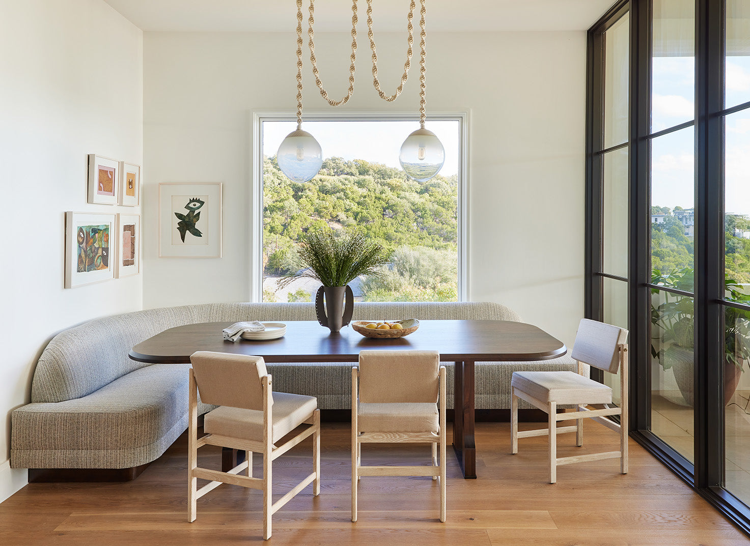 an interior view with midcentury modern furniture and northern wide wood planks on the floor