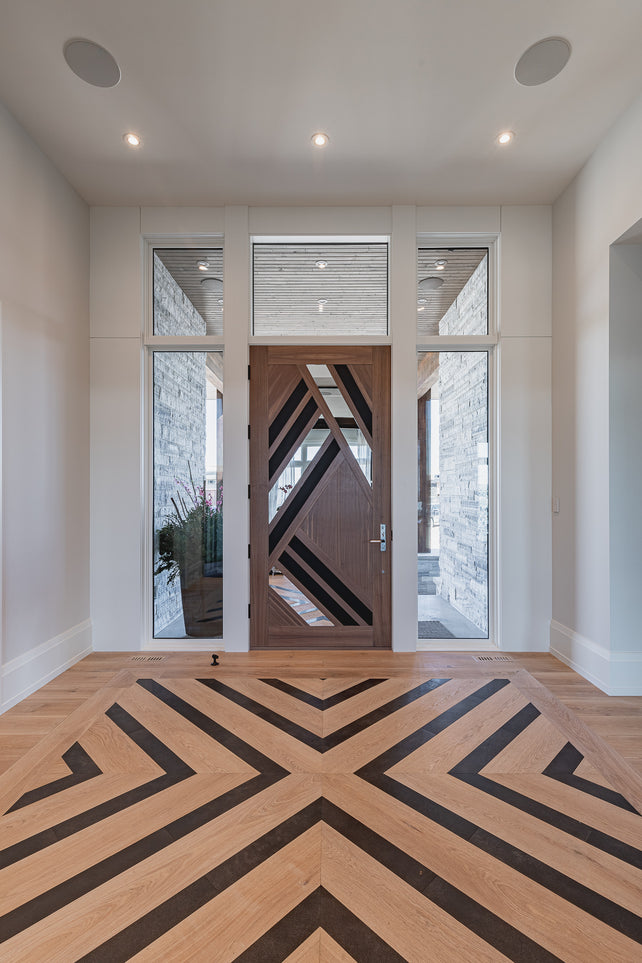 an interior view with midcentury modern furniture and northern wide wood planks on the floor