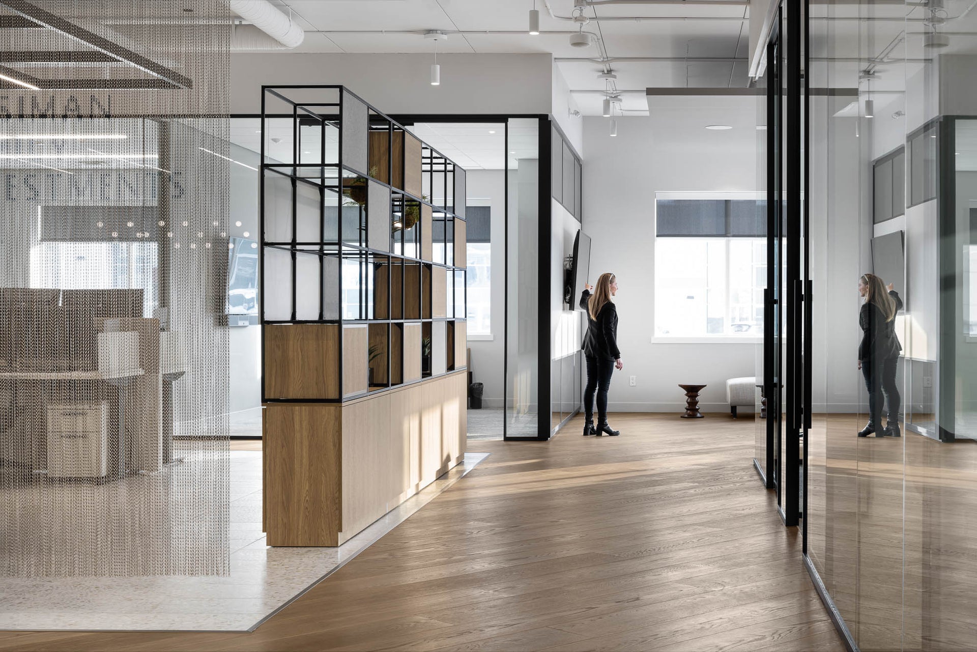 an interior view with midcentury modern furniture and northern wide wood planks on the floor