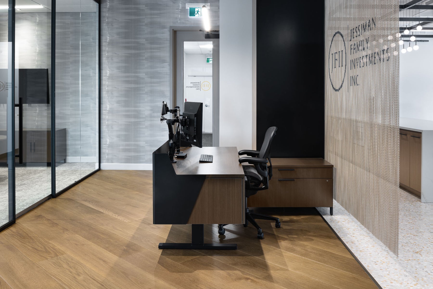 an interior view with midcentury modern furniture and northern wide wood planks on the floor