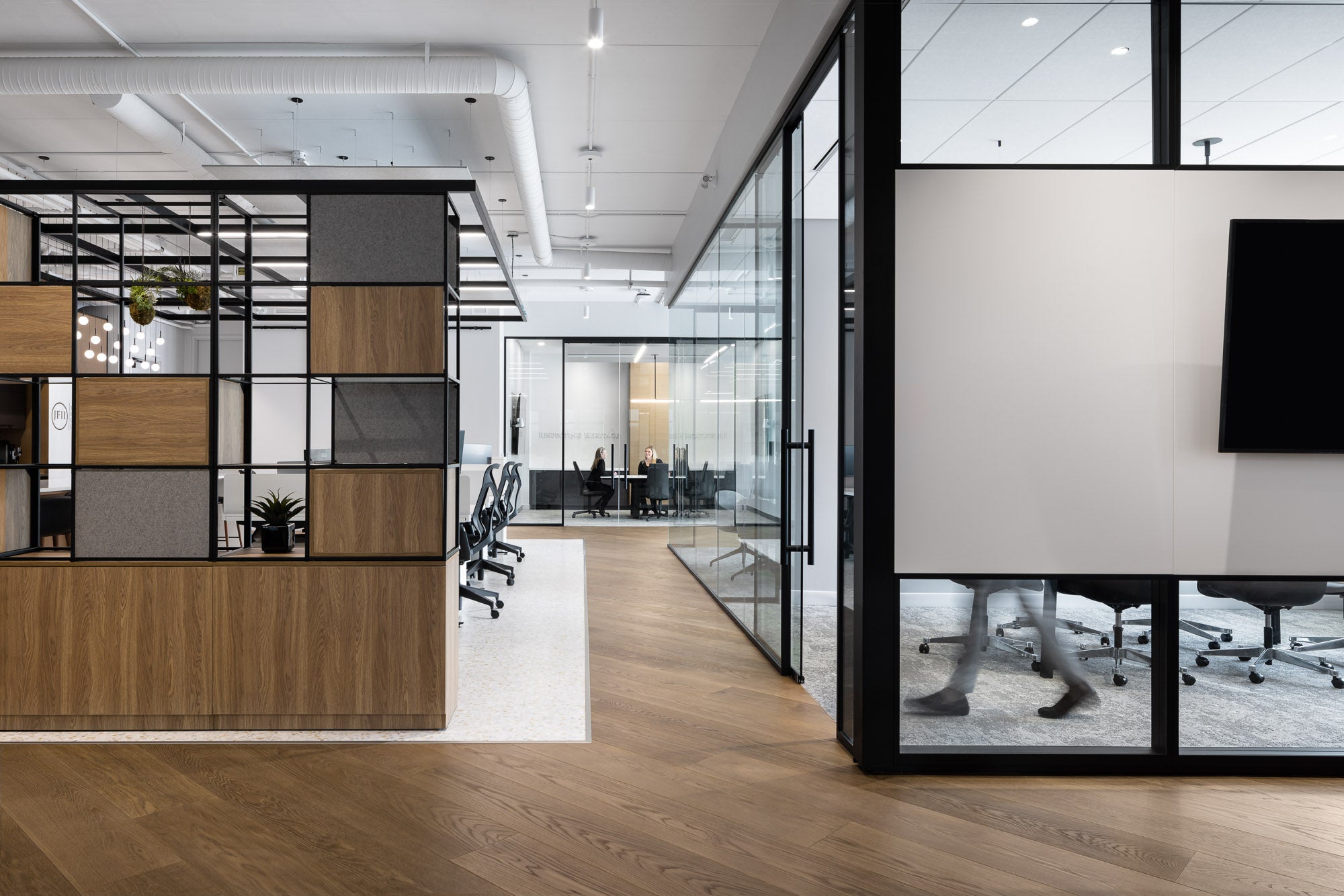 an interior view with midcentury modern furniture and northern wide wood planks on the floor