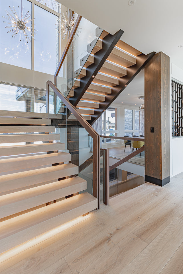 an interior view with midcentury modern furniture and northern wide wood planks on the floor