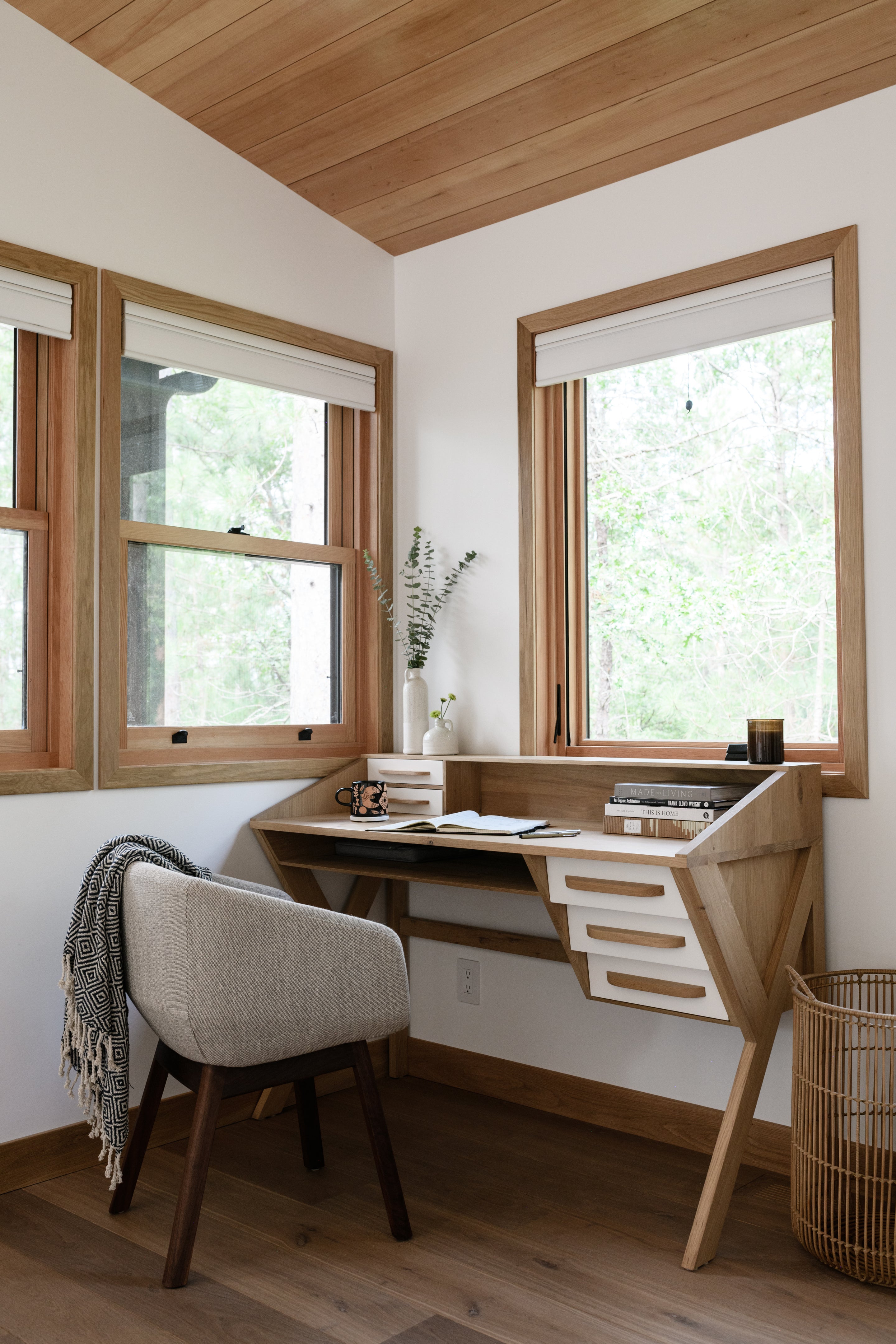 an interior view with midcentury modern furniture and northern wide wood planks on the floor