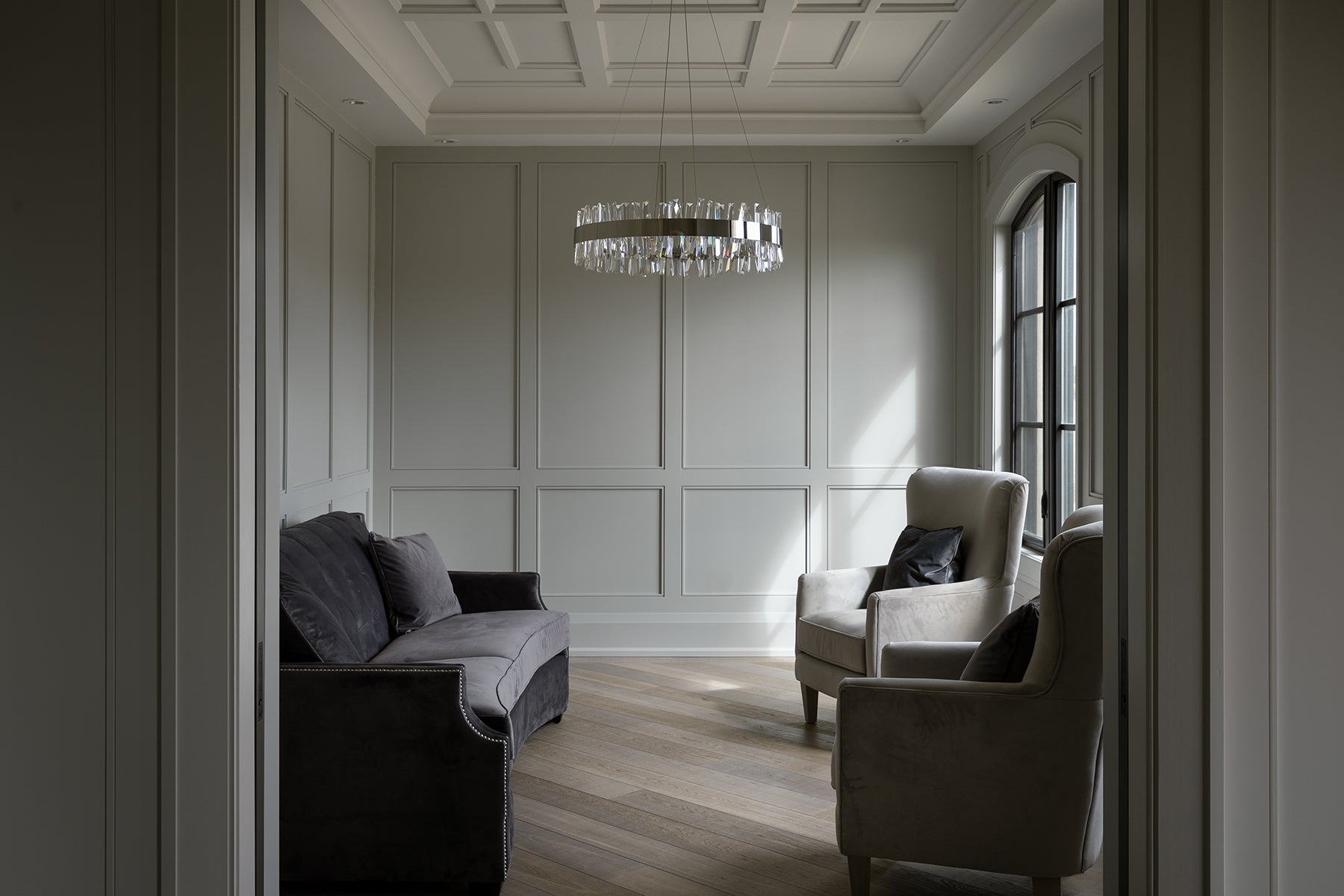 an interior view with midcentury modern furniture and northern wide wood planks on the floor