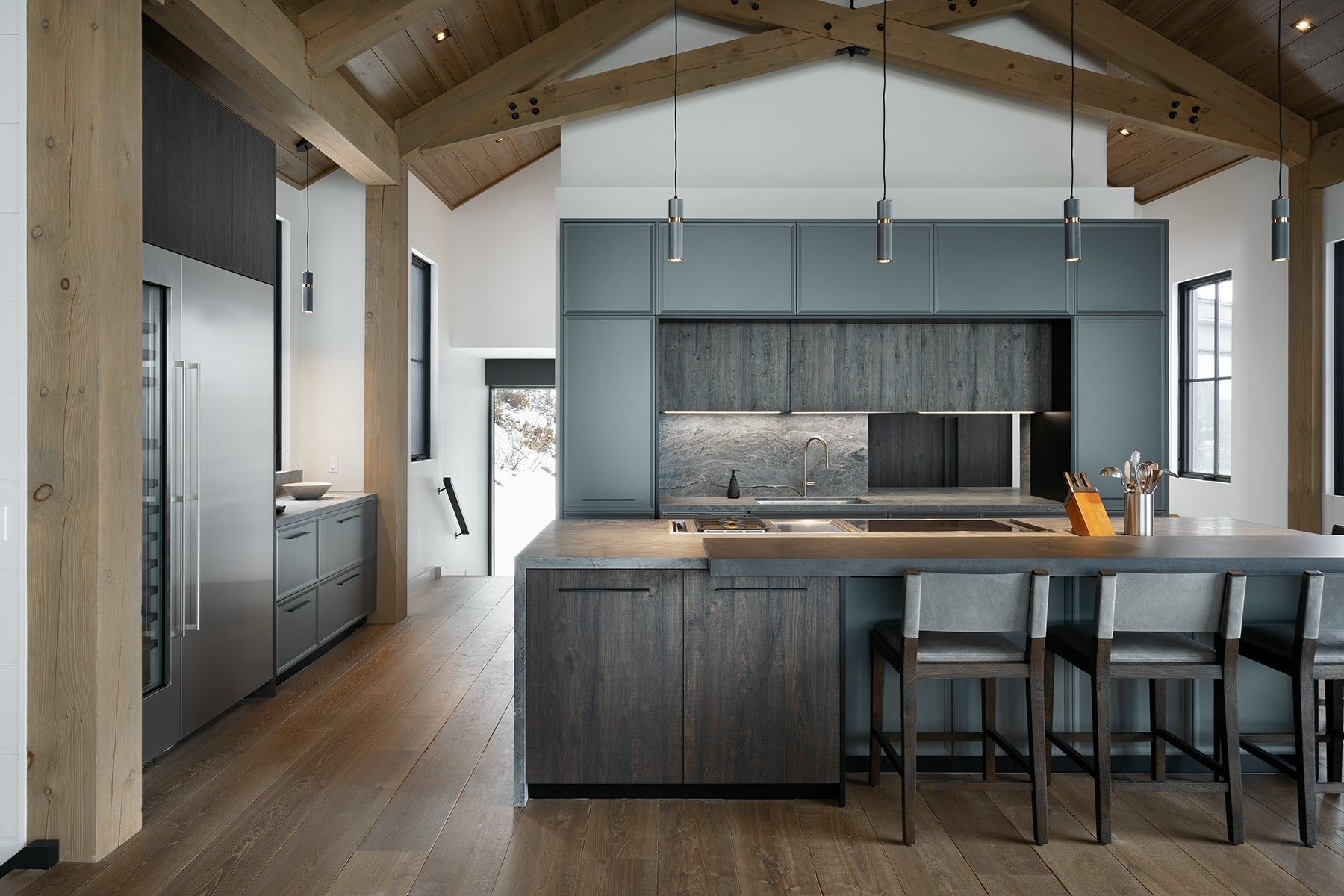 an interior view with midcentury modern furniture and northern wide wood planks on the floor