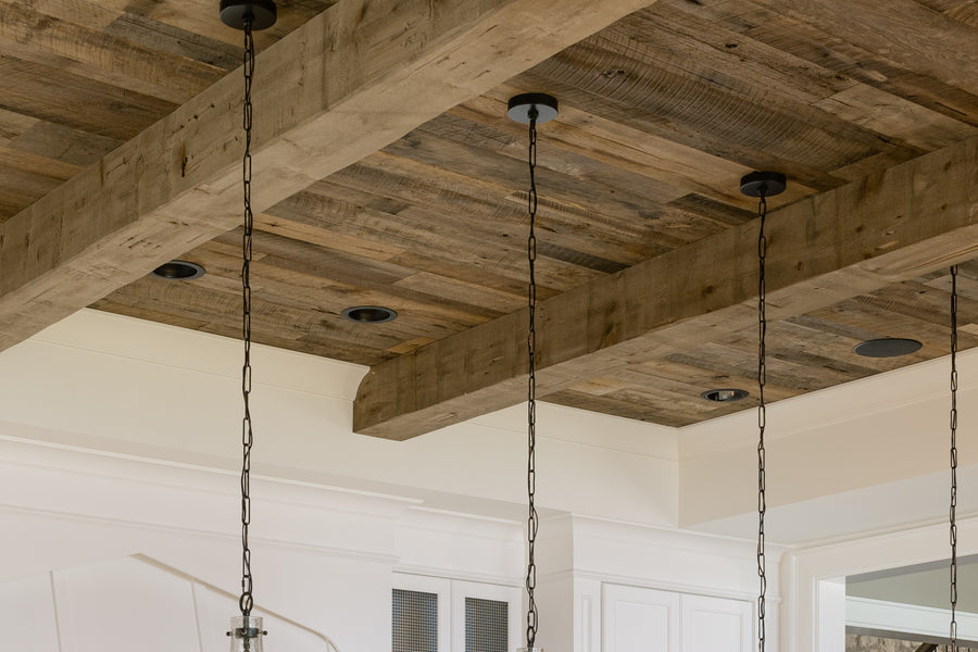 an interior view with midcentury modern furniture and northern wide wood planks on the floor