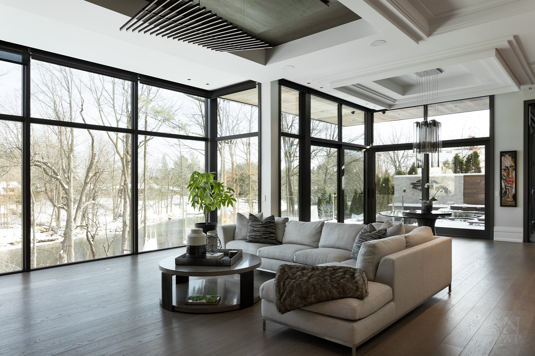 an interior view with midcentury modern furniture and northern wide wood planks on the floor