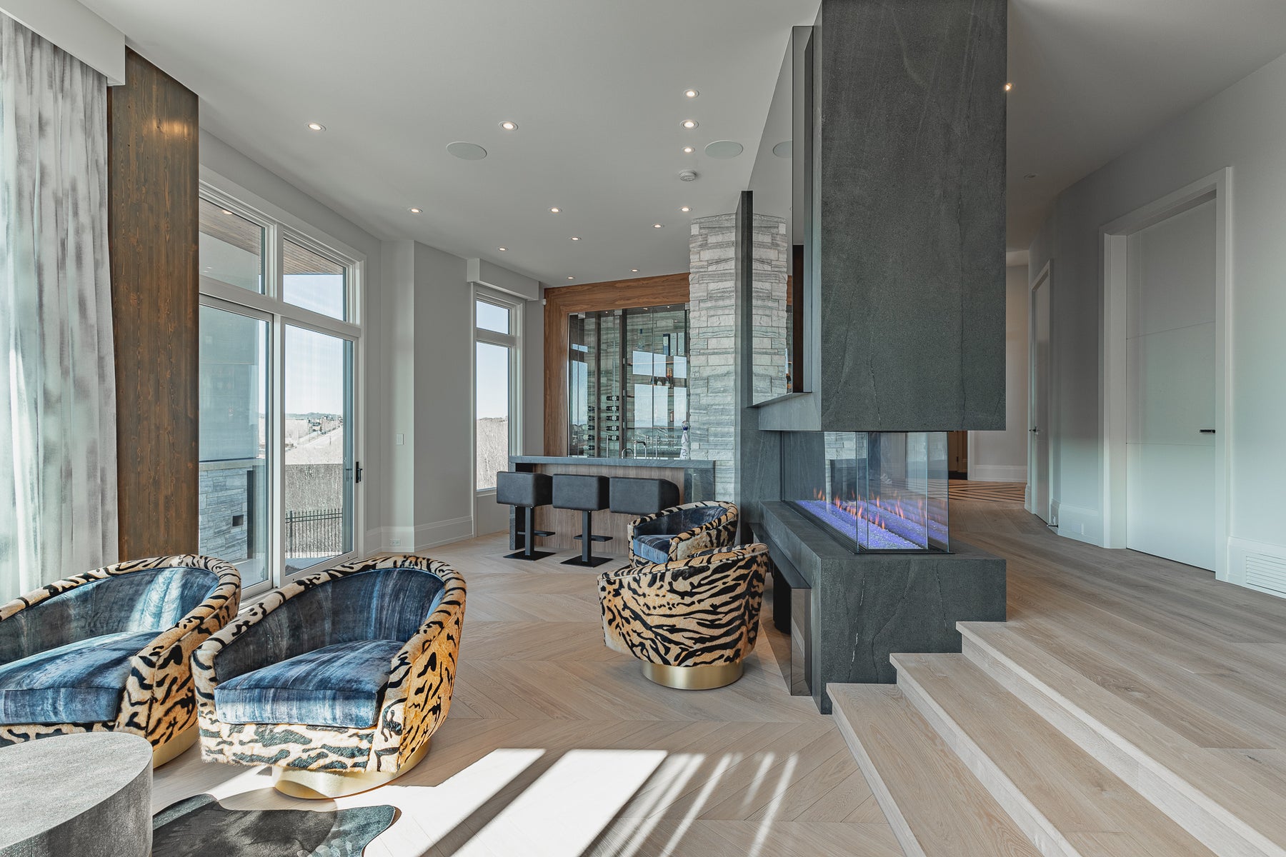 an interior view with midcentury modern furniture and northern wide wood planks on the floor