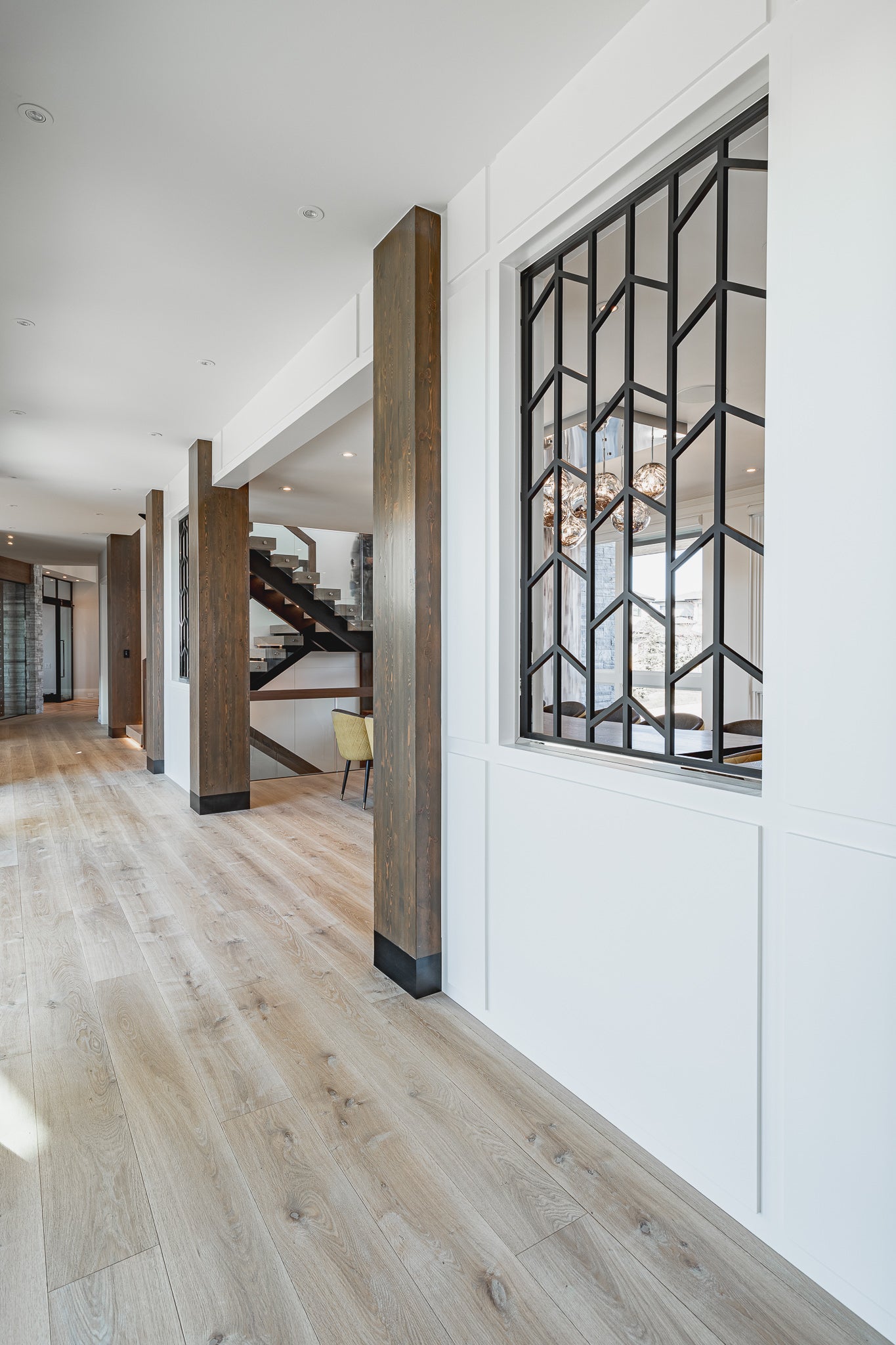 an interior view with midcentury modern furniture and northern wide wood planks on the floor