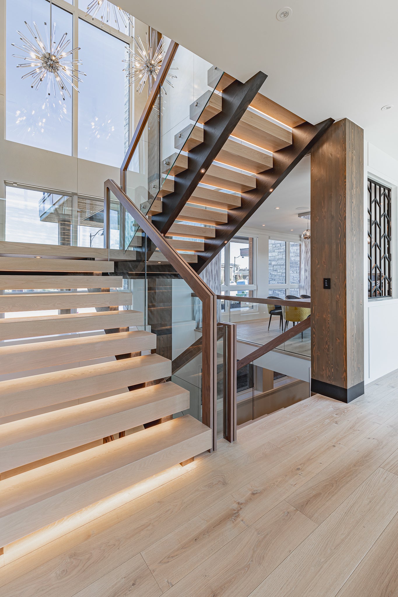 an interior view with midcentury modern furniture and northern wide wood planks on the floor