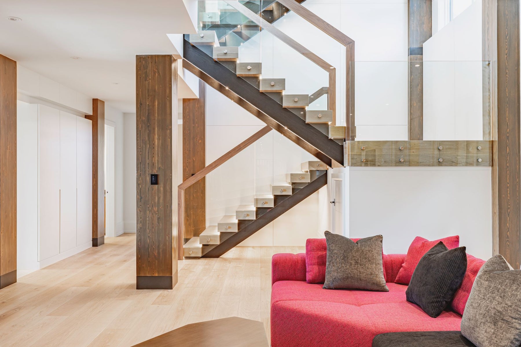 an interior view with midcentury modern furniture and northern wide wood planks on the floor