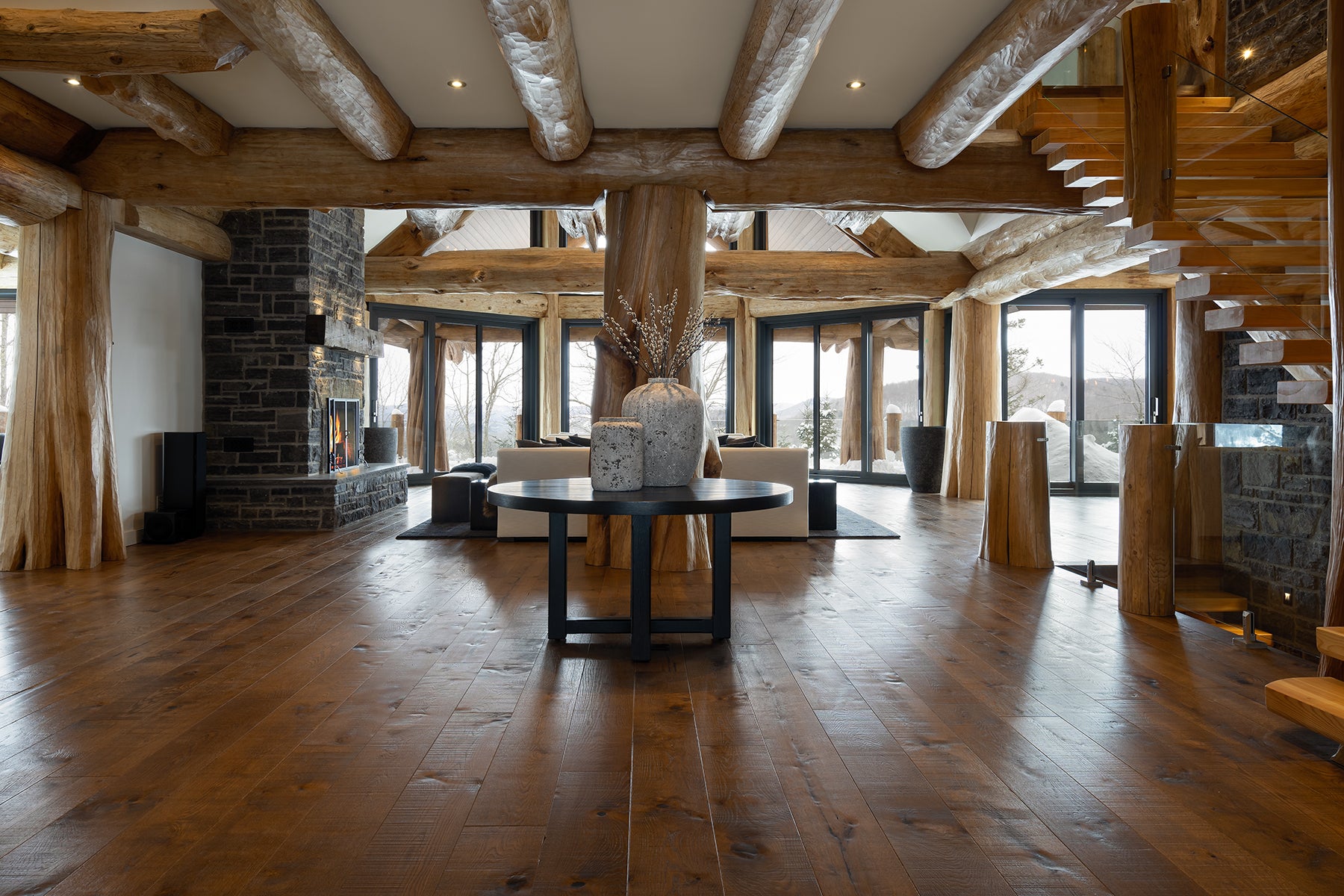 an interior view with midcentury modern furniture and northern wide wood planks on the floor