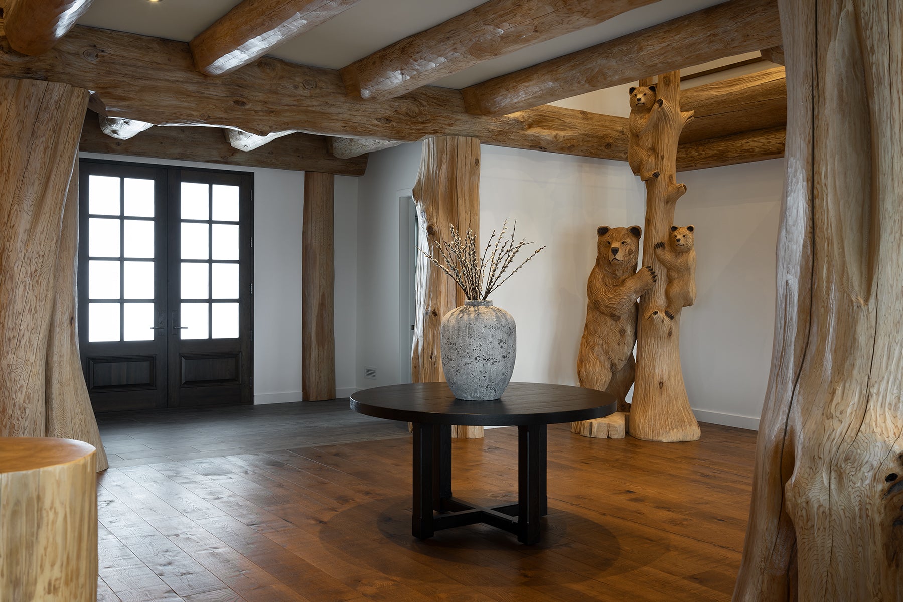 an interior view with midcentury modern furniture and northern wide wood planks on the floor