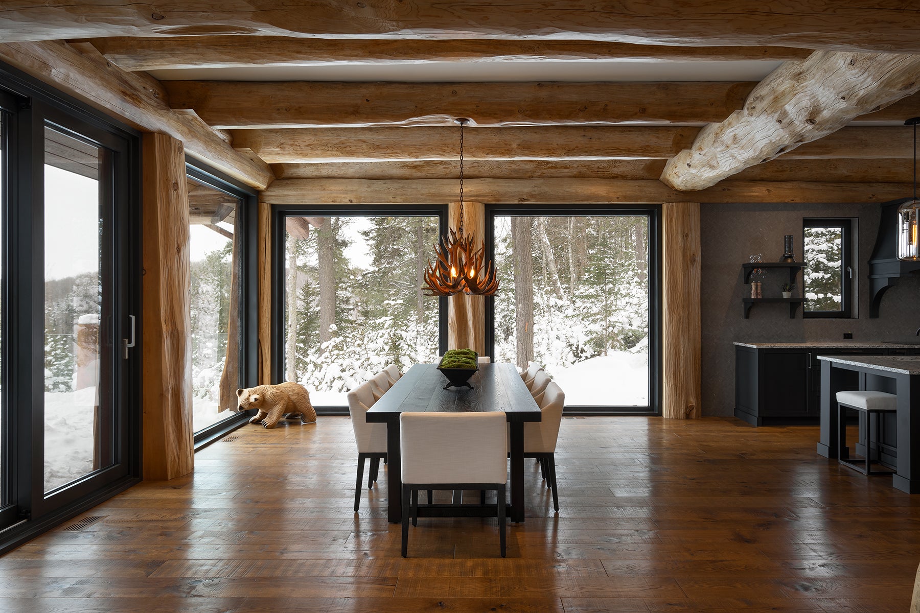 an interior view with midcentury modern furniture and northern wide wood planks on the floor