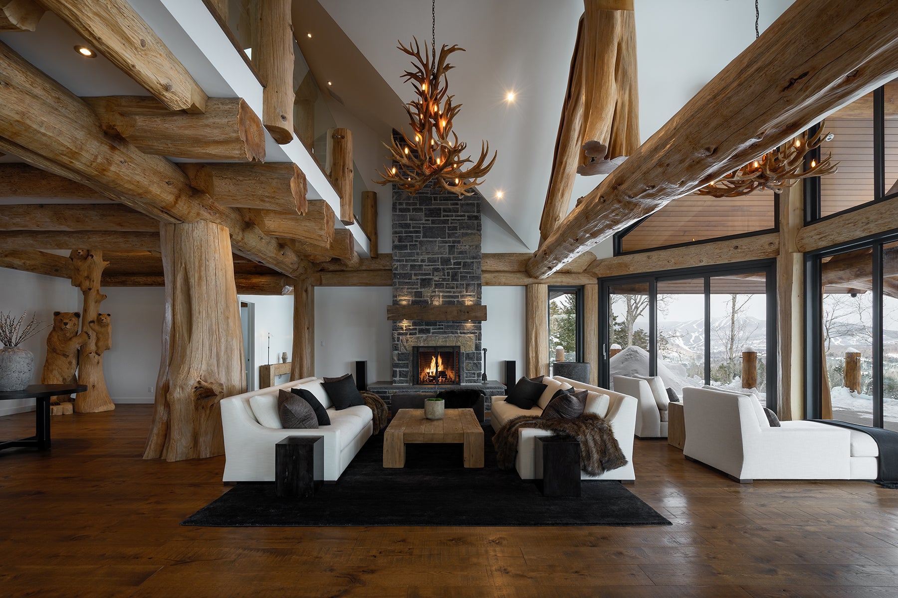 an interior view with midcentury modern furniture and northern wide wood planks on the floor