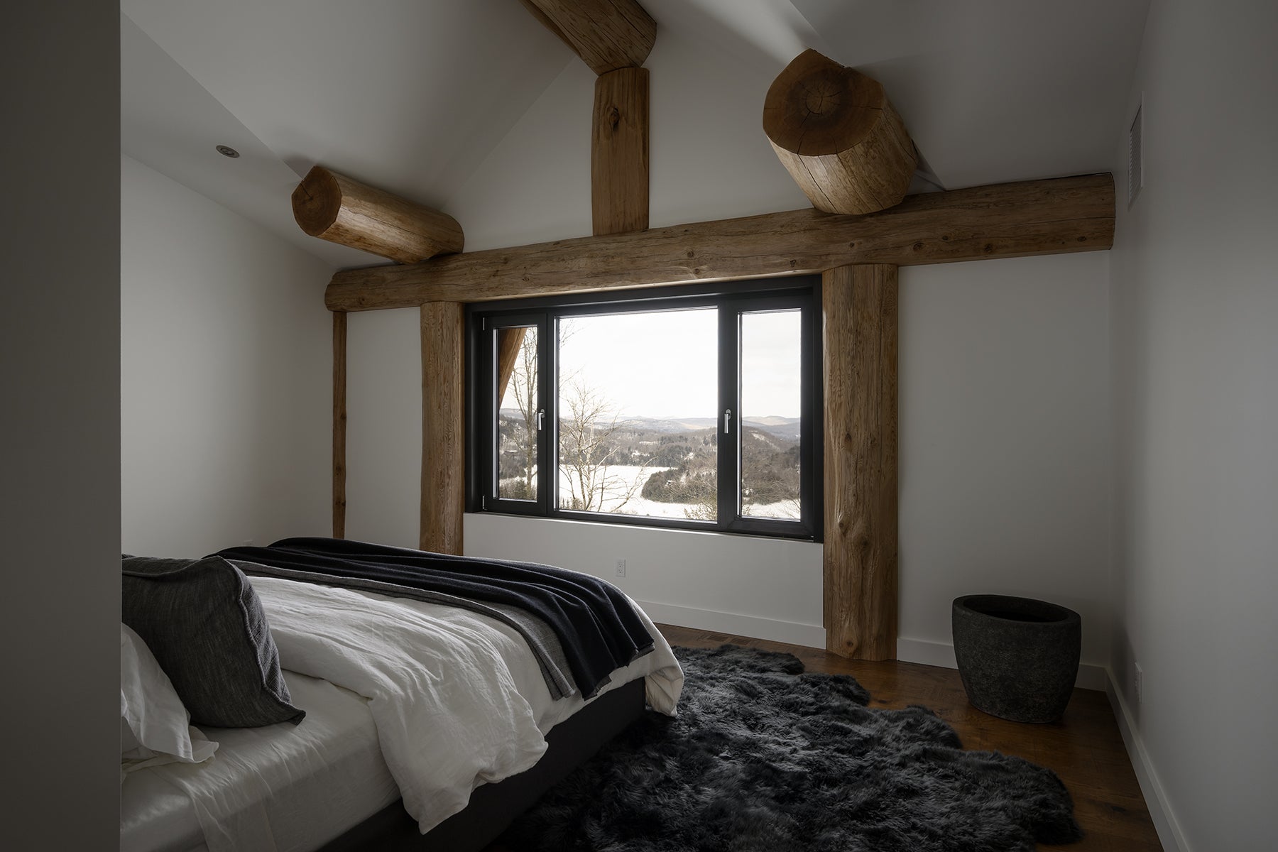 an interior view with midcentury modern furniture and northern wide wood planks on the floor