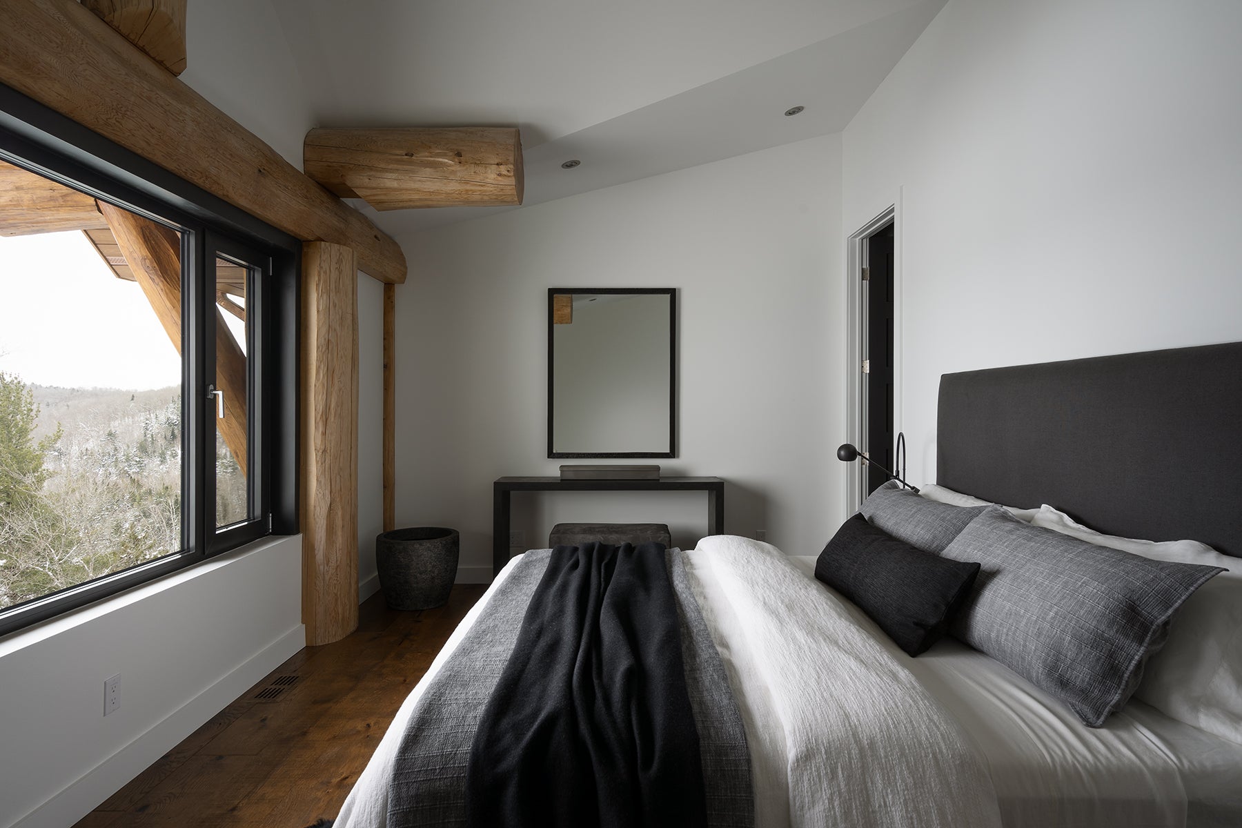 an interior view with midcentury modern furniture and northern wide wood planks on the floor