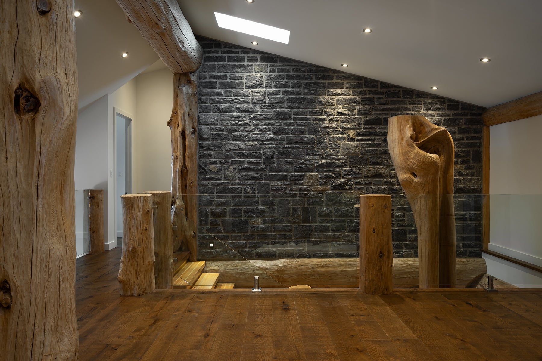 an interior view with midcentury modern furniture and northern wide wood planks on the floor