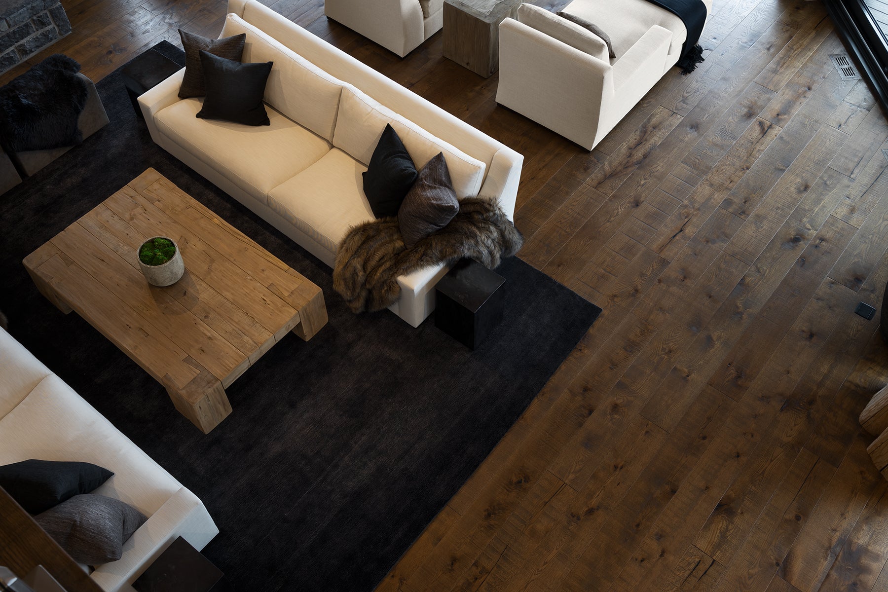 an interior view with midcentury modern furniture and northern wide wood planks on the floor