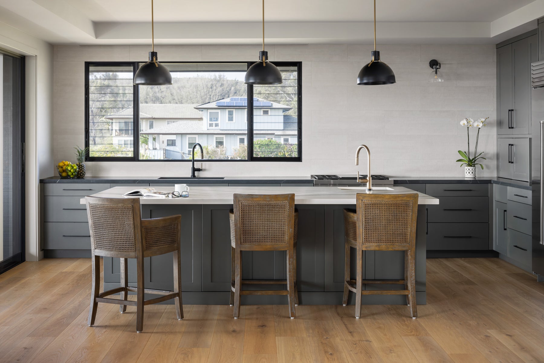 an interior view with midcentury modern furniture and northern wide wood planks on the floor