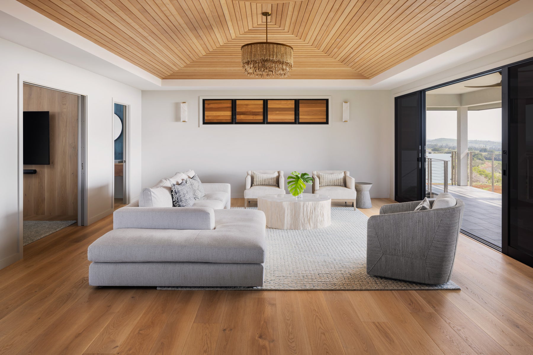 an interior view with midcentury modern furniture and northern wide wood planks on the floor