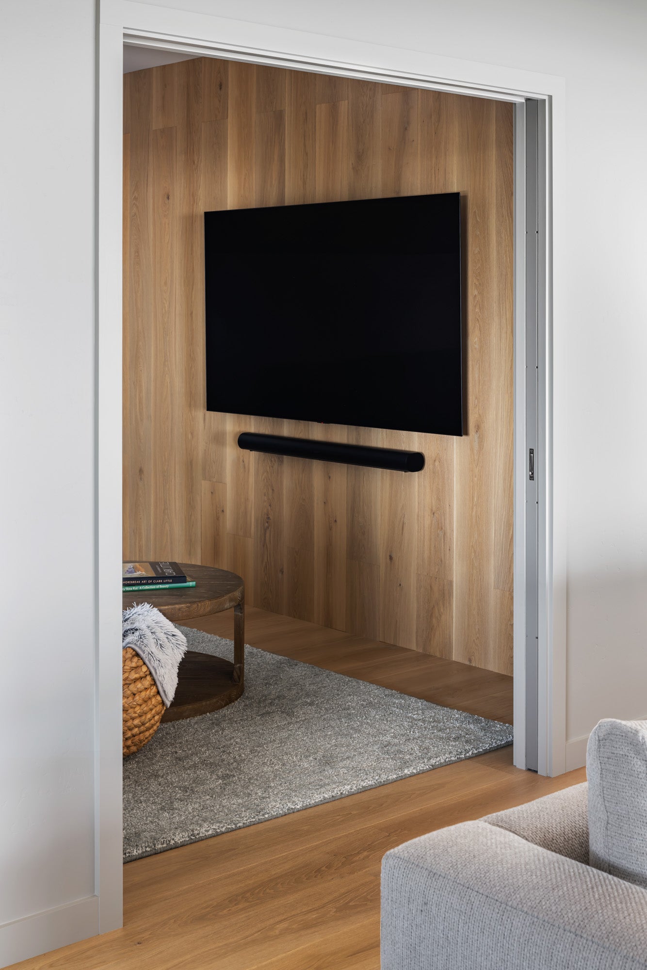 an interior view with midcentury modern furniture and northern wide wood planks on the floor