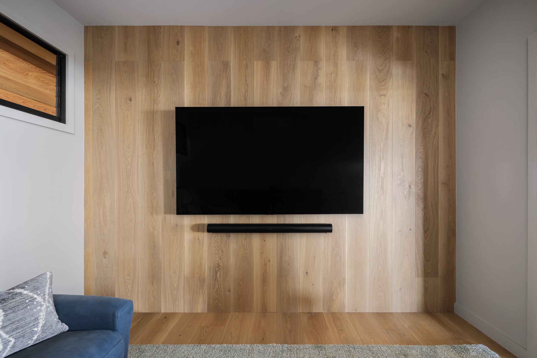 an interior view with midcentury modern furniture and northern wide wood planks on the floor