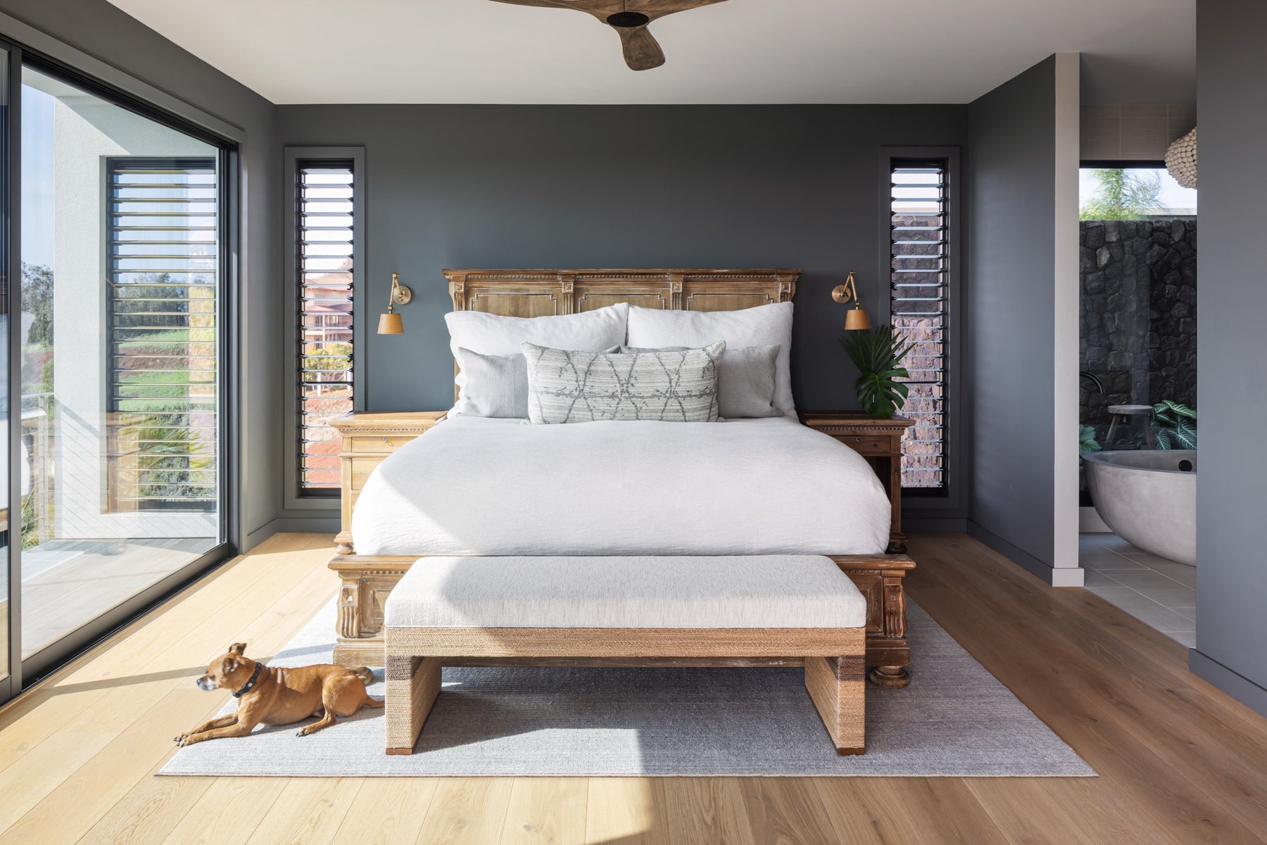 an interior view with midcentury modern furniture and northern wide wood planks on the floor