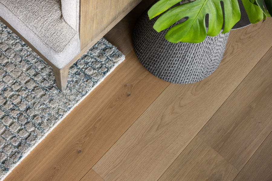 an interior view with midcentury modern furniture and northern wide wood planks on the floor