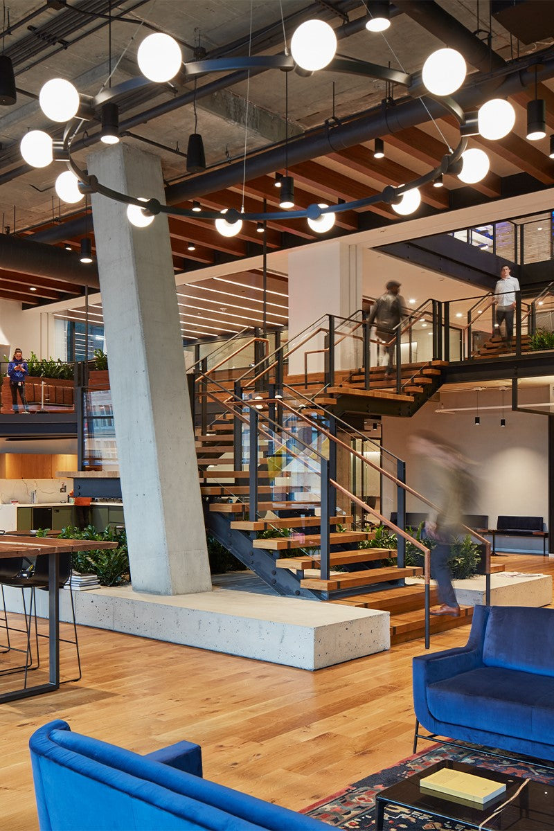 an interior view with midcentury modern furniture and northern wide wood planks on the floor