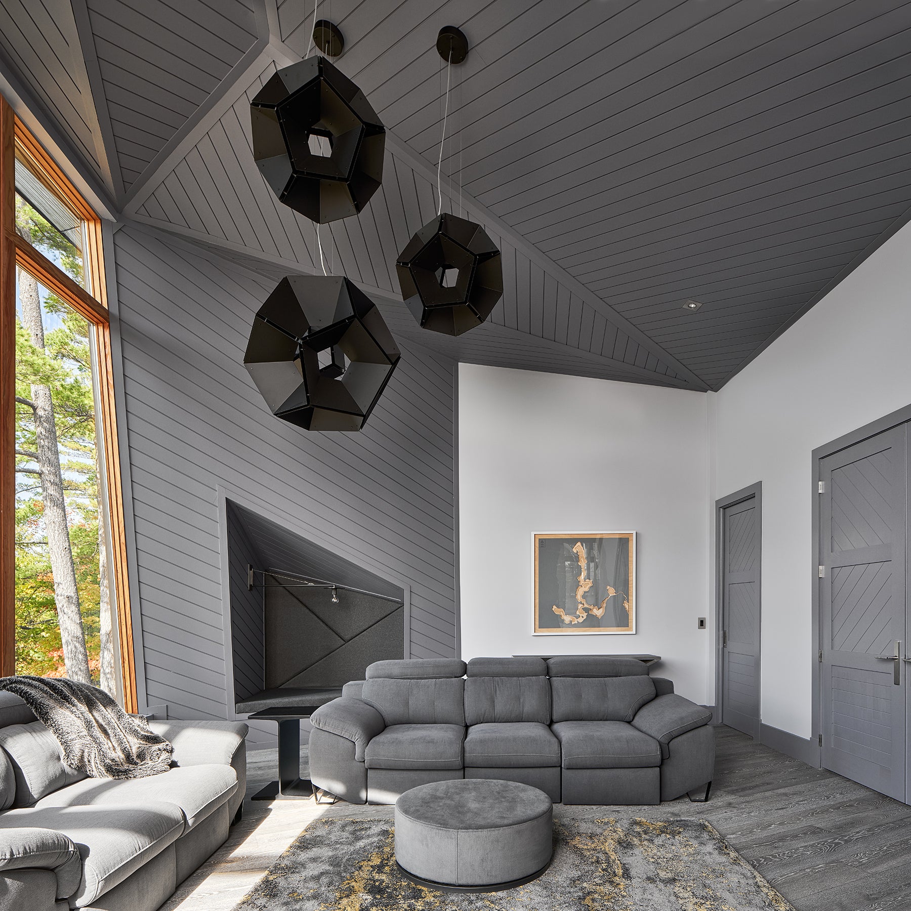 an interior view with midcentury modern furniture and northern wide wood planks on the floor