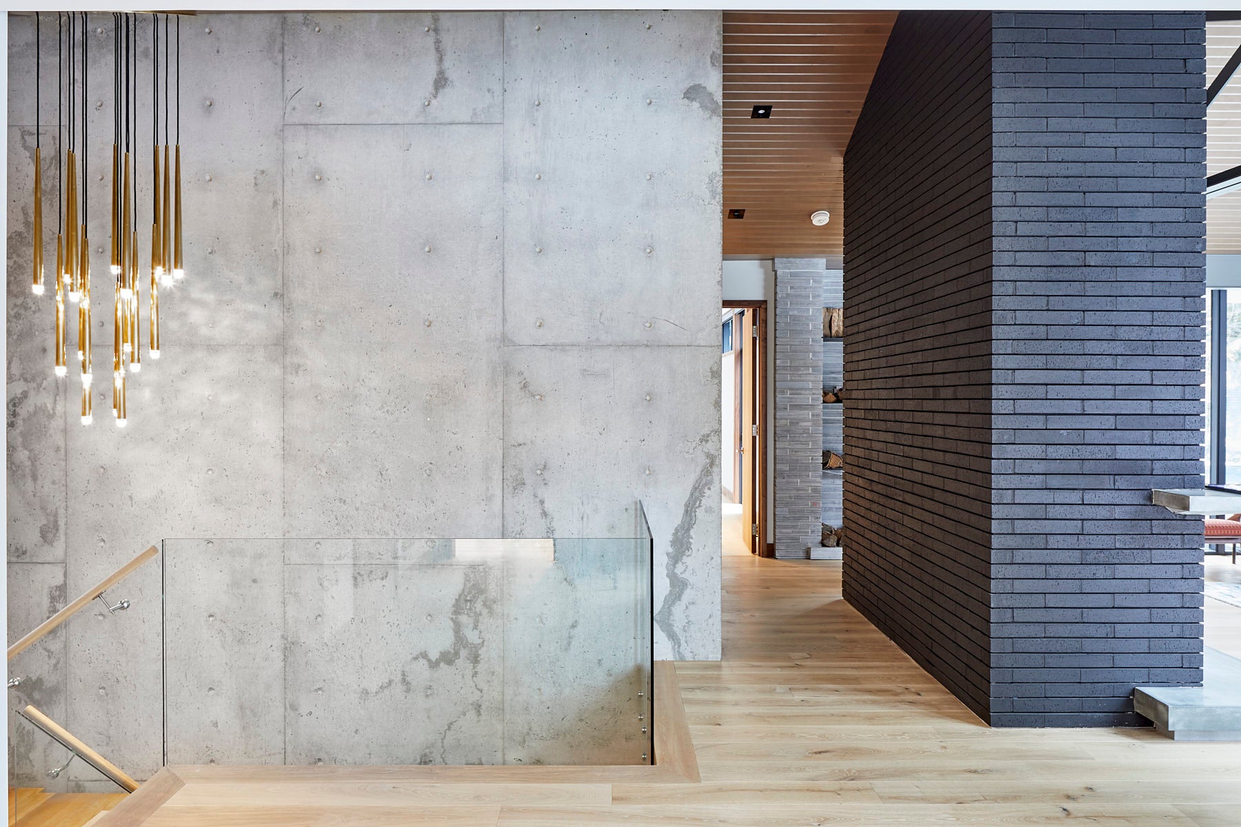 an interior view with midcentury modern furniture and northern wide wood planks on the floor