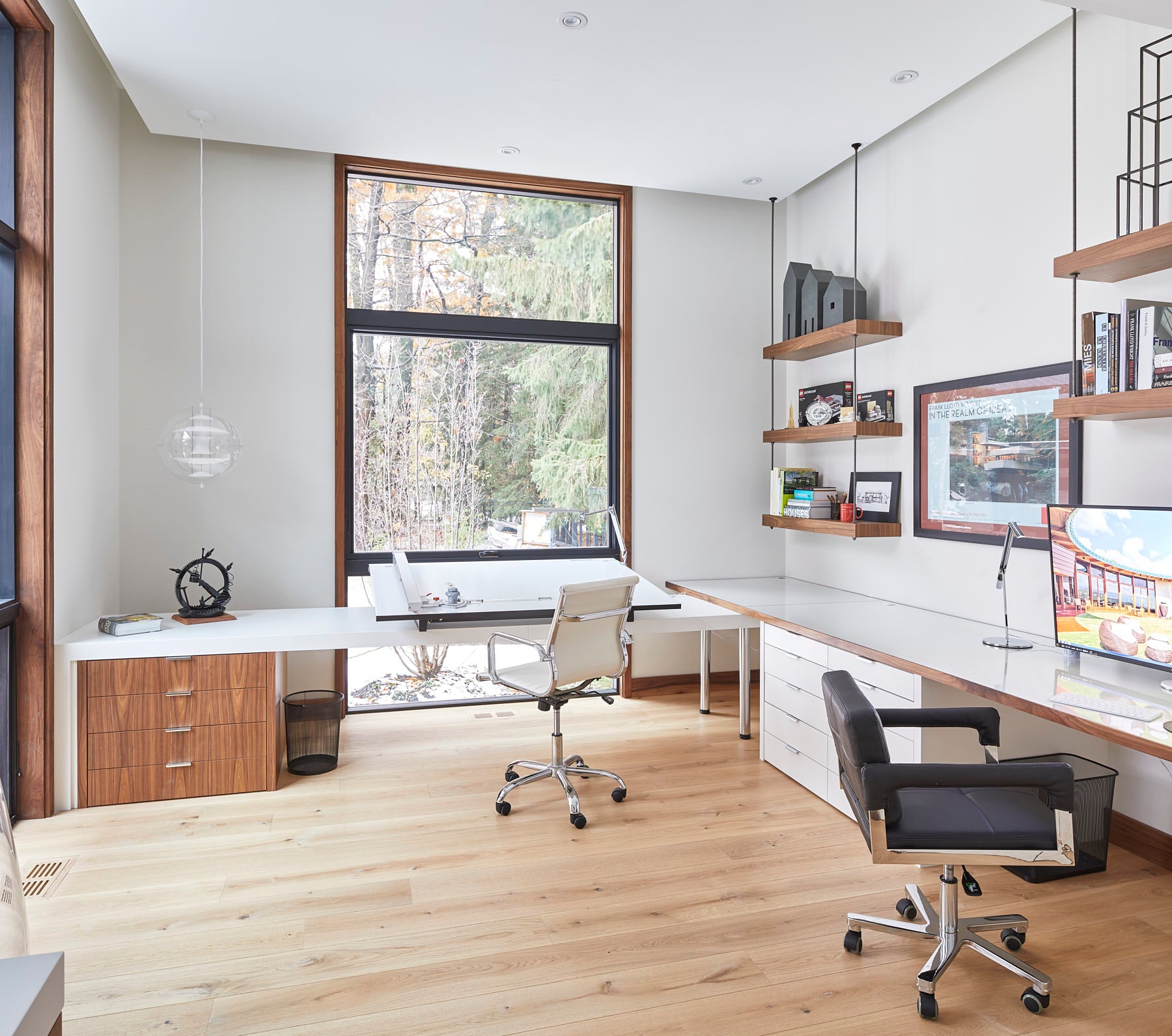 an interior view with midcentury modern furniture and northern wide wood planks on the floor