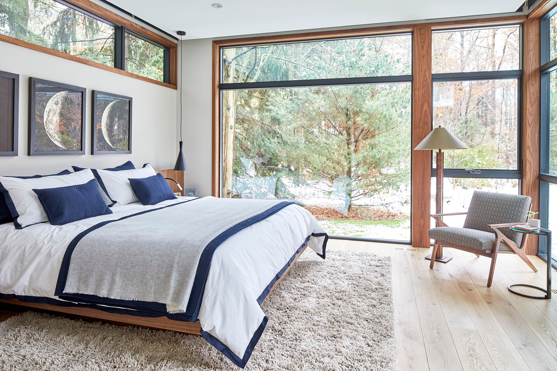 an interior view with midcentury modern furniture and northern wide wood planks on the floor