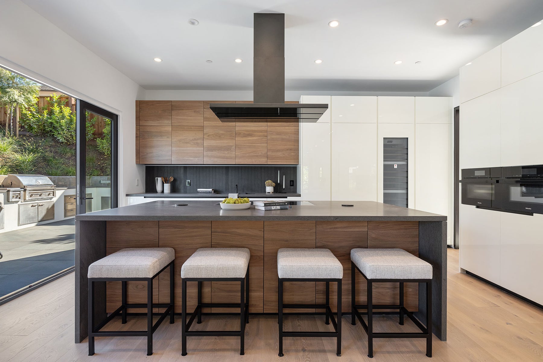 an interior view with midcentury modern furniture and northern wide wood planks on the floor