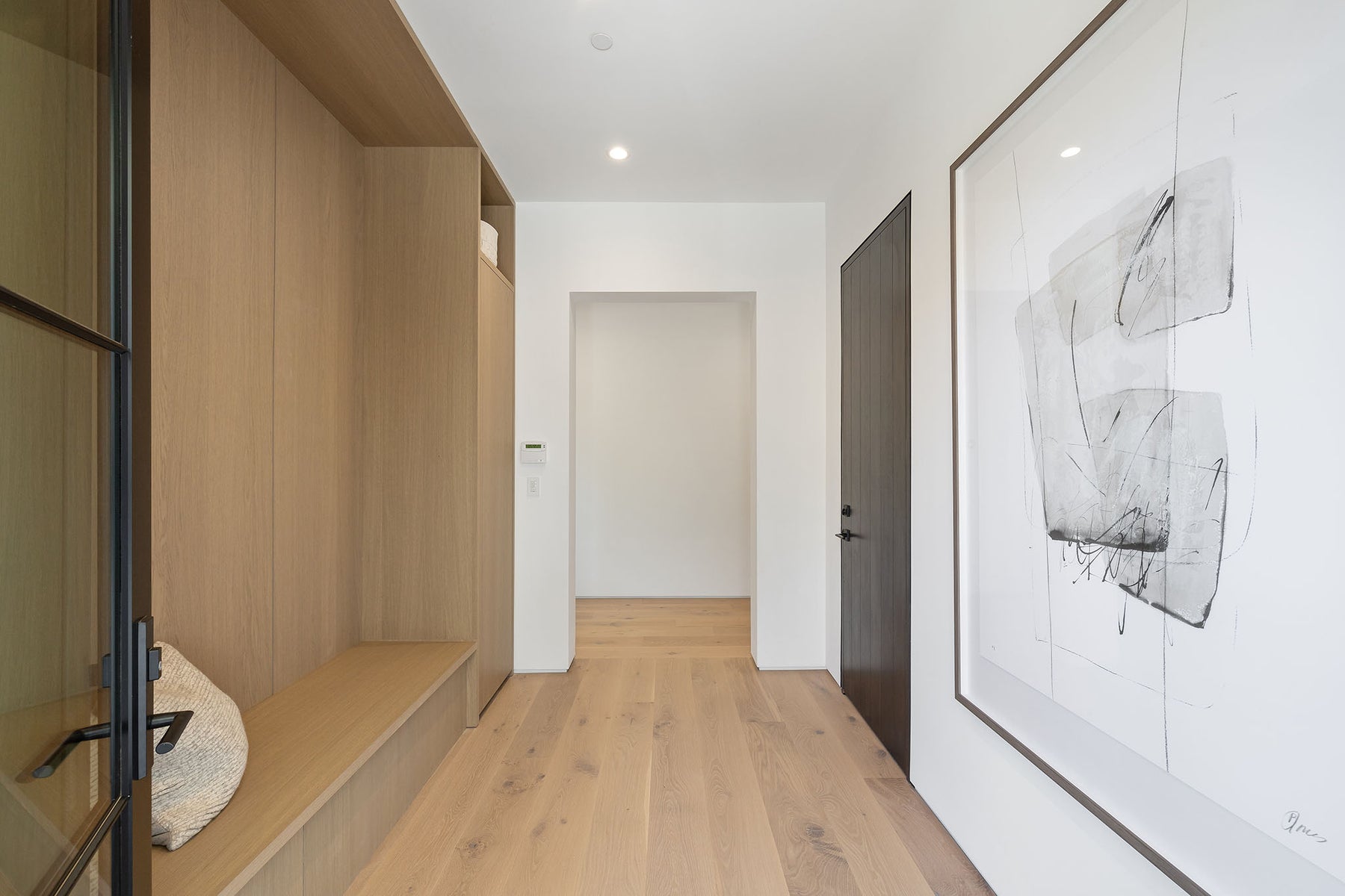 an interior view with midcentury modern furniture and northern wide wood planks on the floor