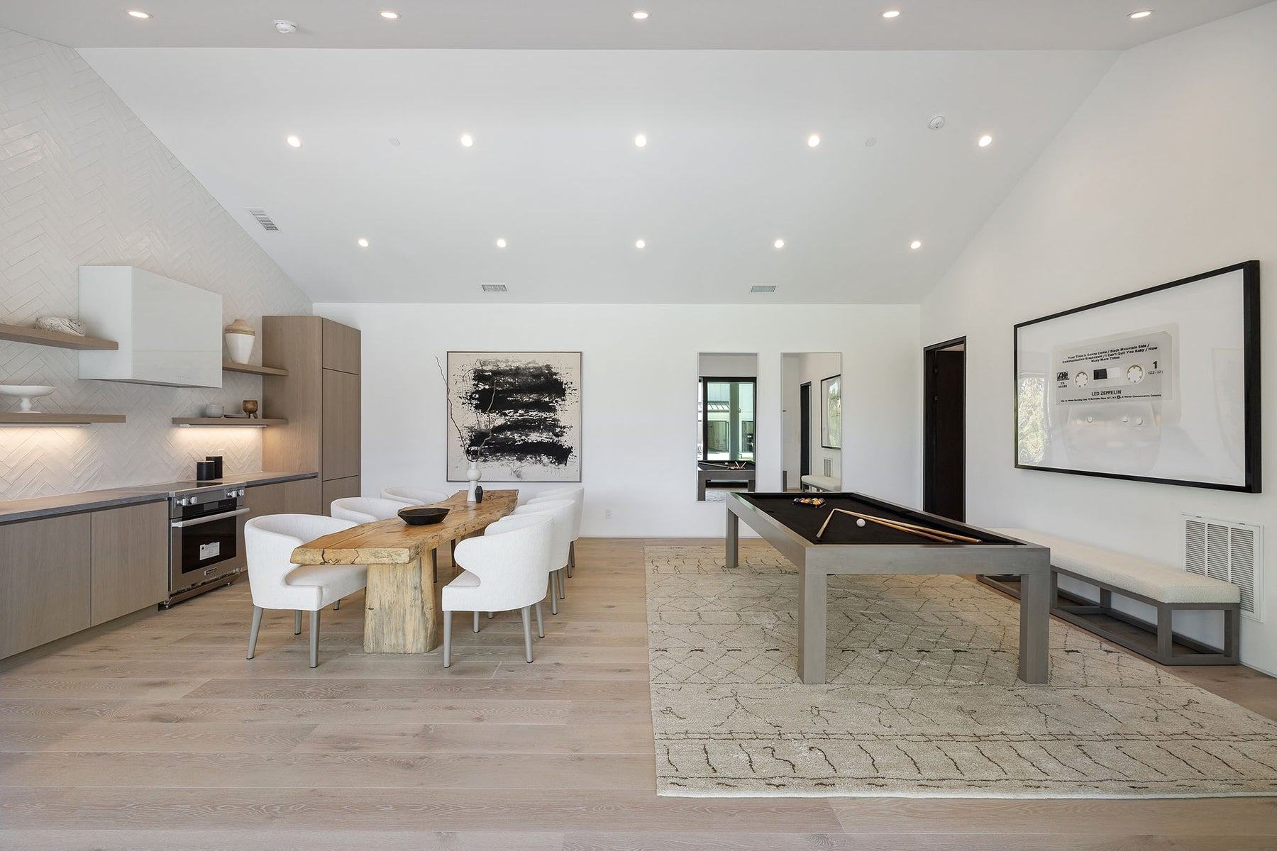 an interior view with midcentury modern furniture and northern wide wood planks on the floor