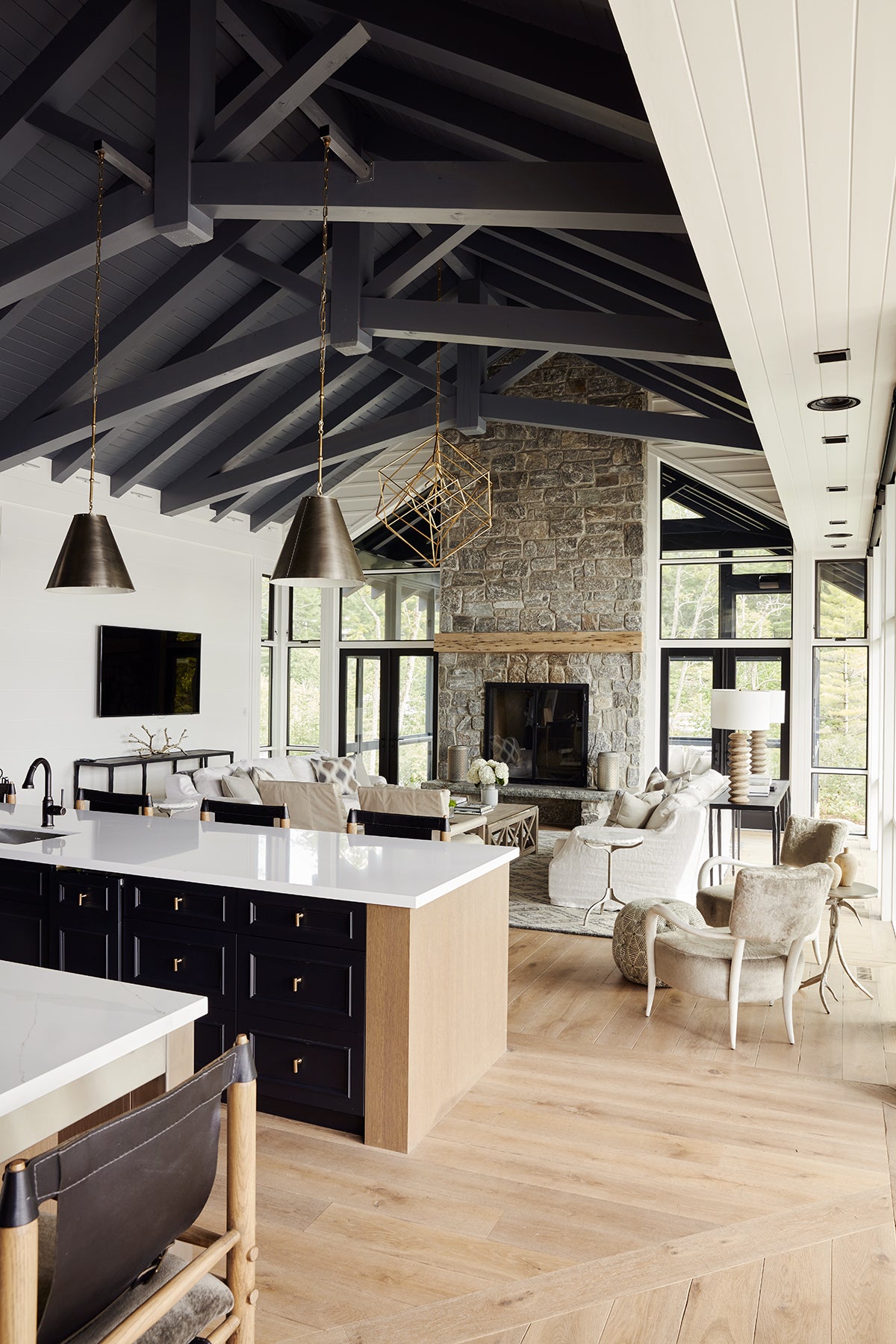 an interior view with midcentury modern furniture and northern wide wood planks on the floor