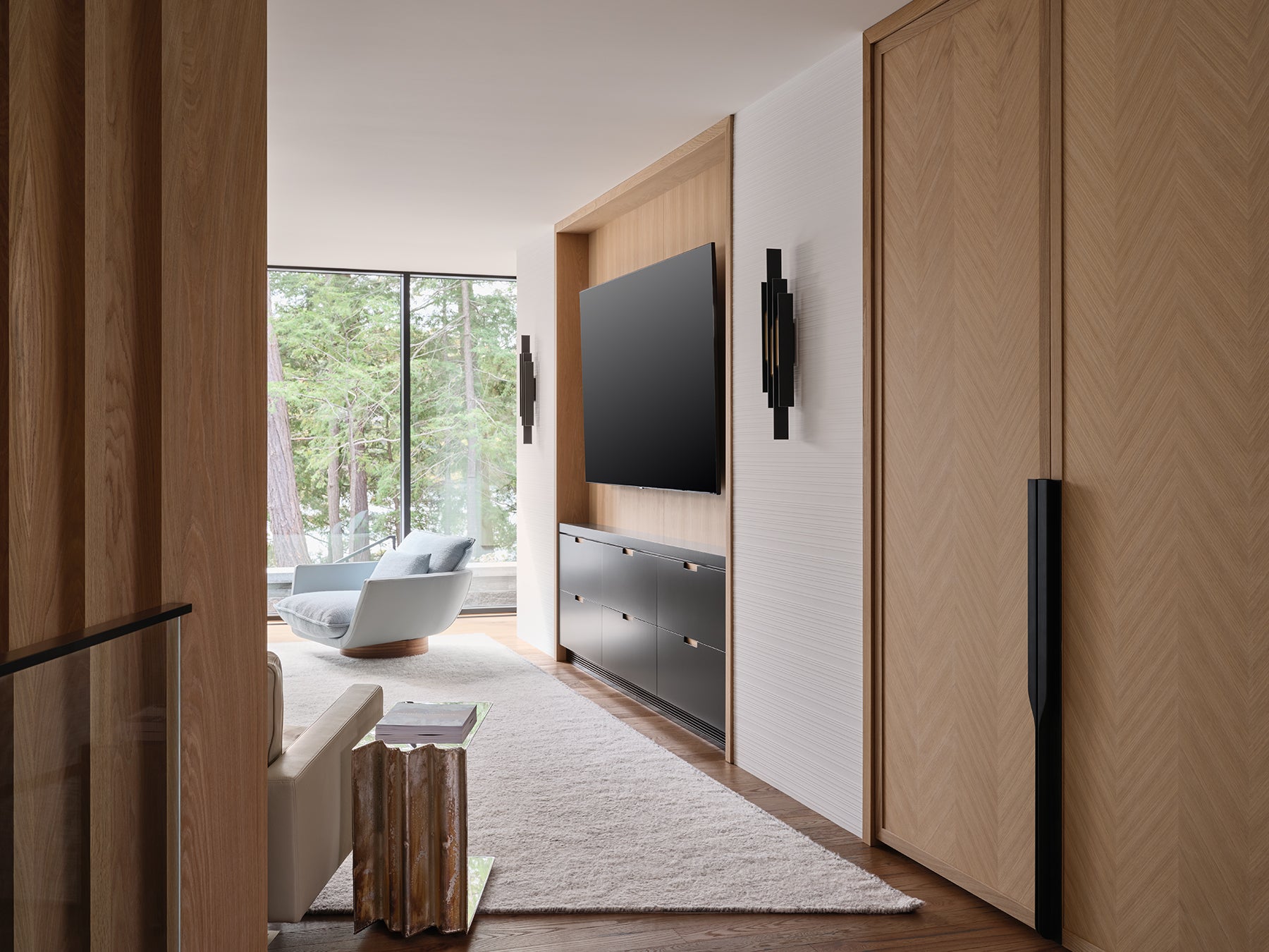 an interior view with midcentury modern furniture and northern wide wood planks on the floor