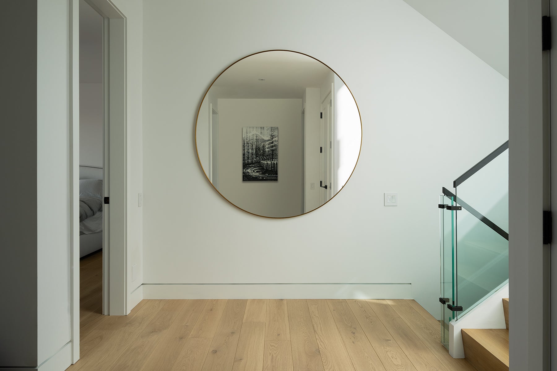 an interior view with midcentury modern furniture and northern wide wood planks on the floor