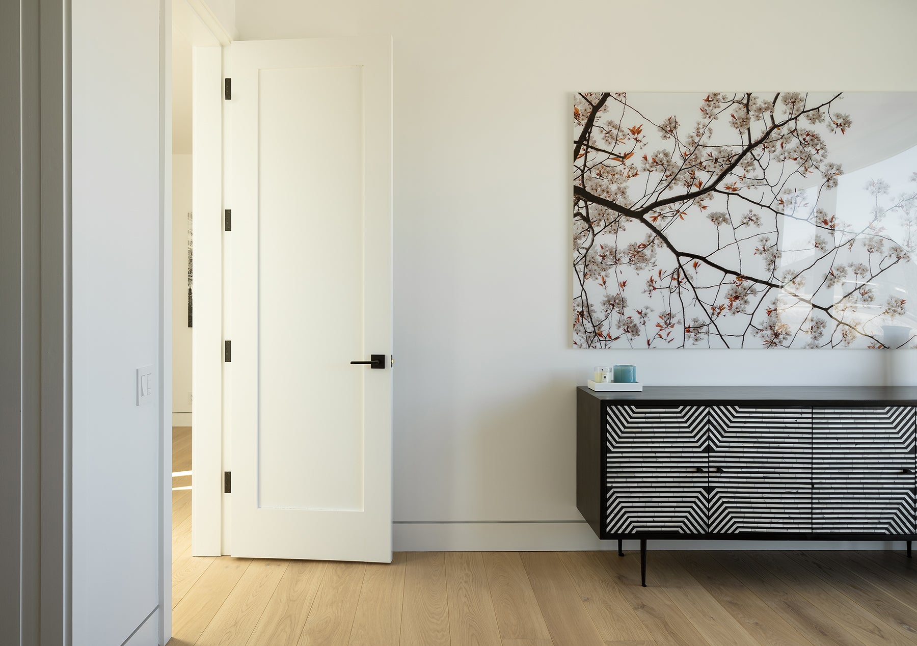 an interior view with midcentury modern furniture and northern wide wood planks on the floor