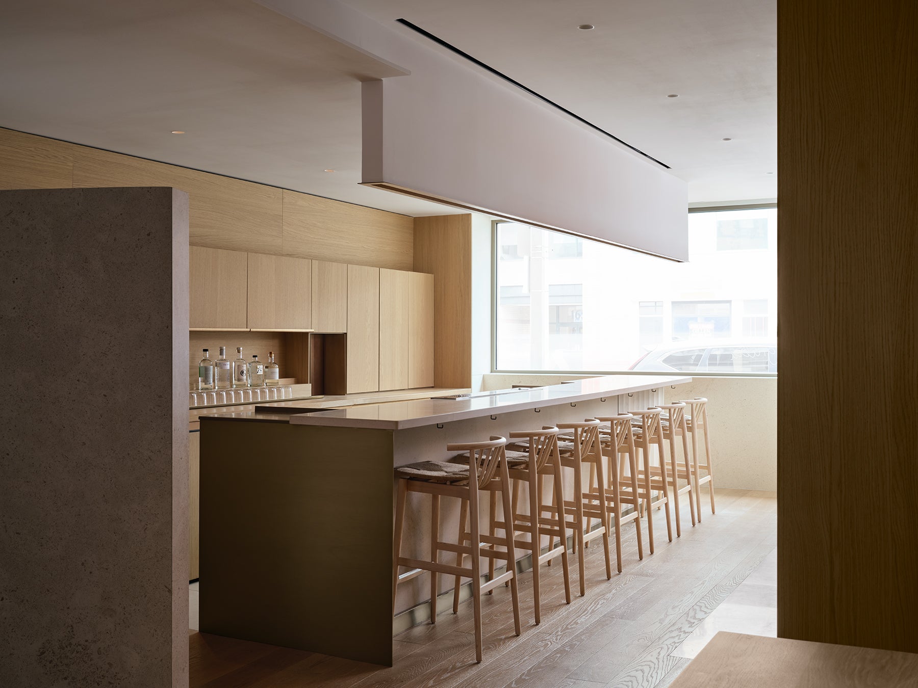 an interior view with midcentury modern furniture and northern wide wood planks on the floor