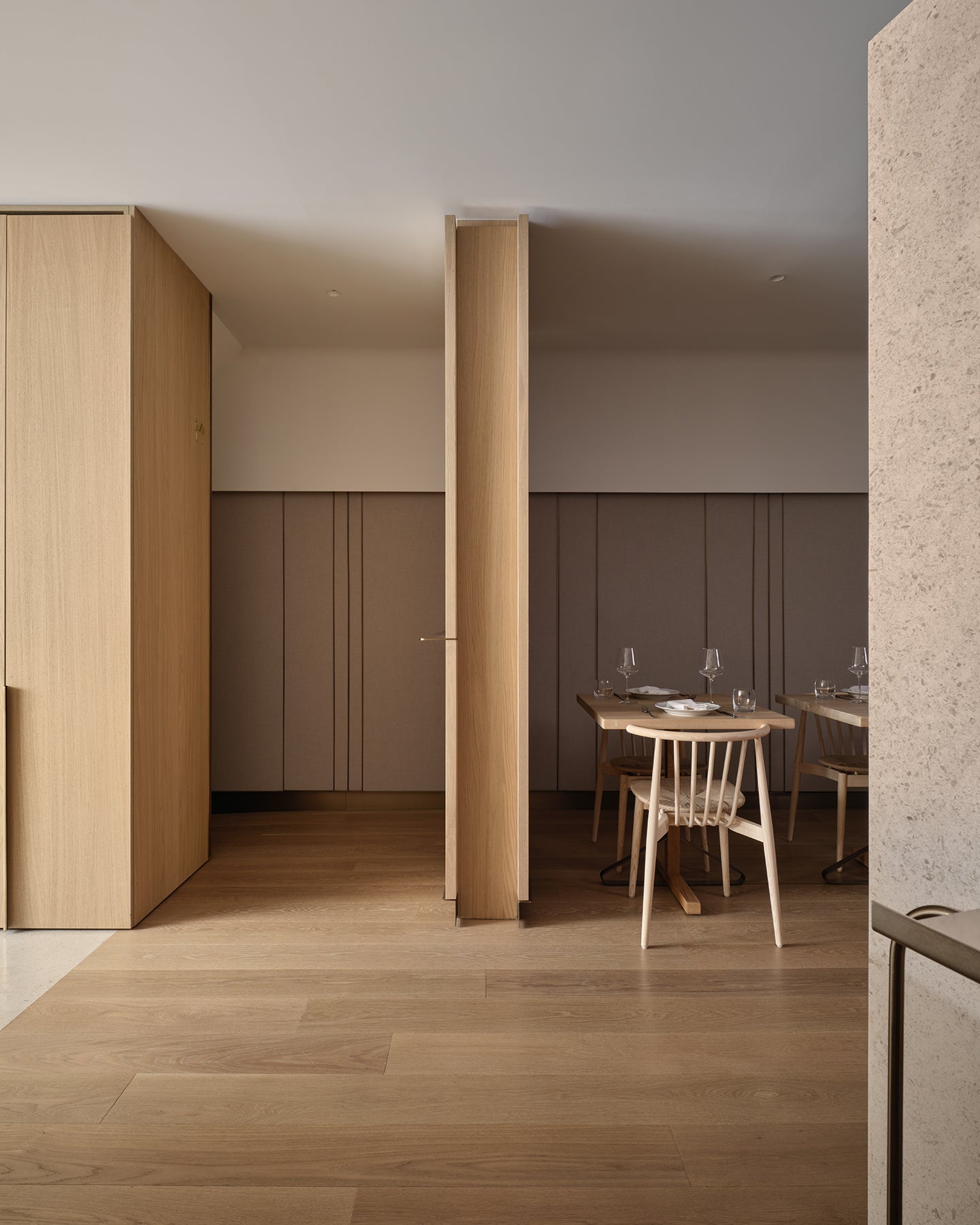 an interior view with midcentury modern furniture and northern wide wood planks on the floor