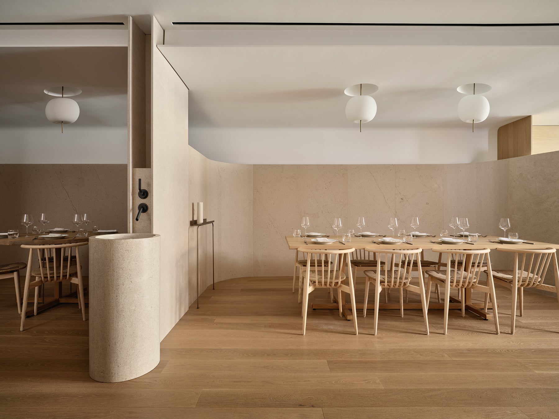 an interior view with midcentury modern furniture and northern wide wood planks on the floor