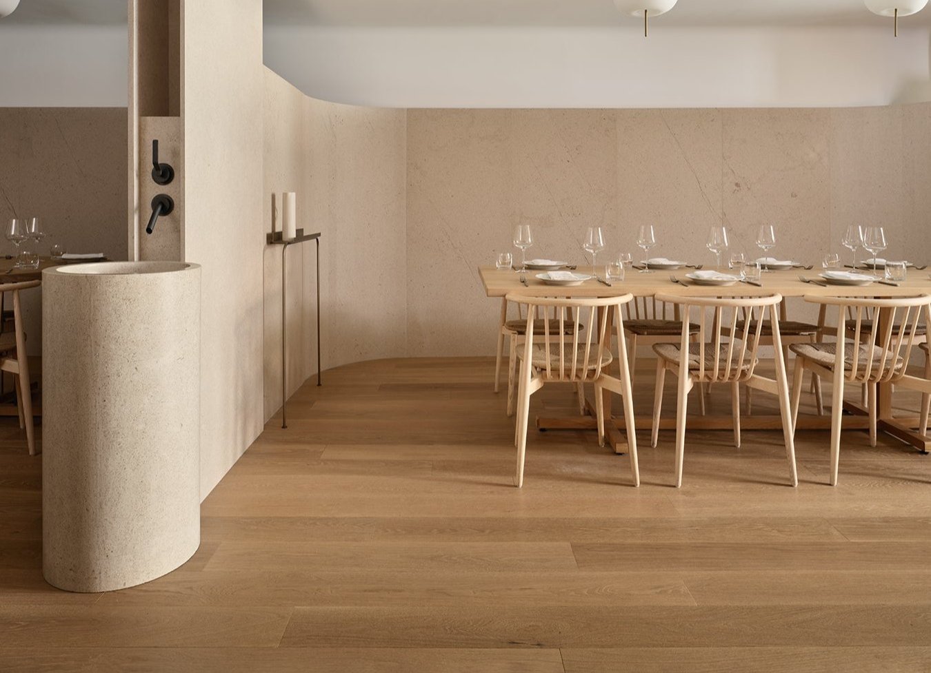 an interior view with midcentury modern furniture and northern wide wood planks on the floor