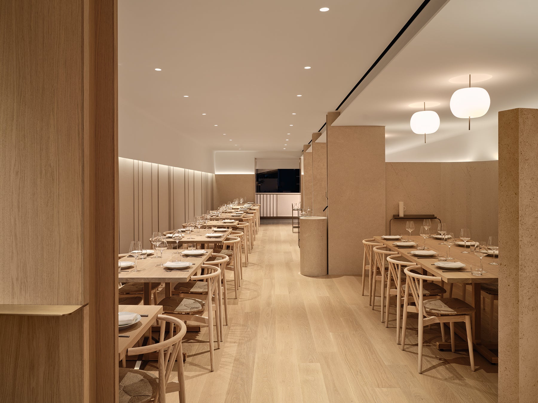 an interior view with midcentury modern furniture and northern wide wood planks on the floor