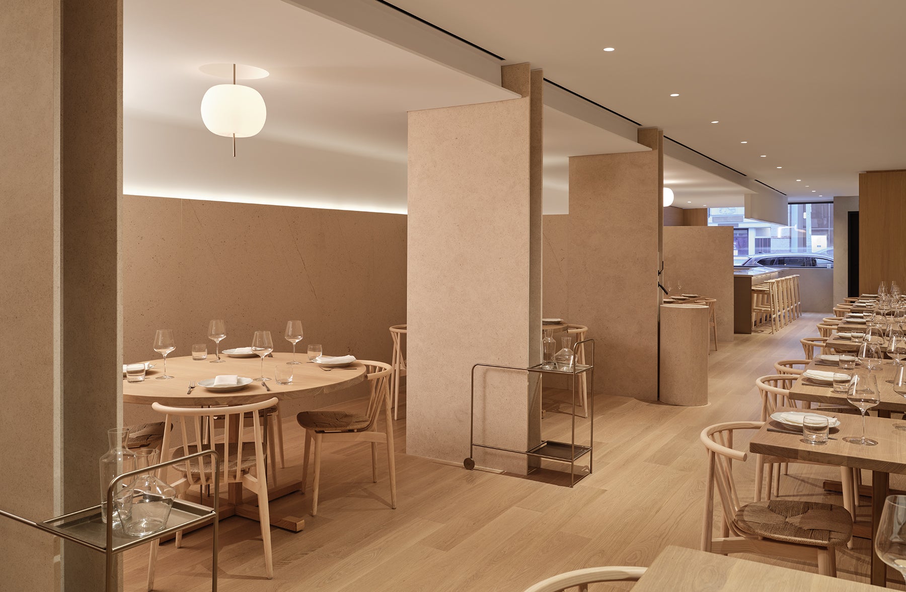 an interior view with midcentury modern furniture and northern wide wood planks on the floor