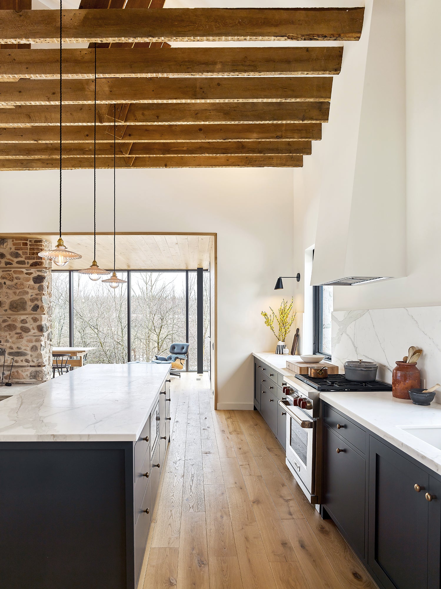 an interior view with midcentury modern furniture and northern wide wood planks on the floor